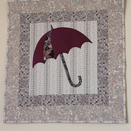 Umbrella applique wall hangning