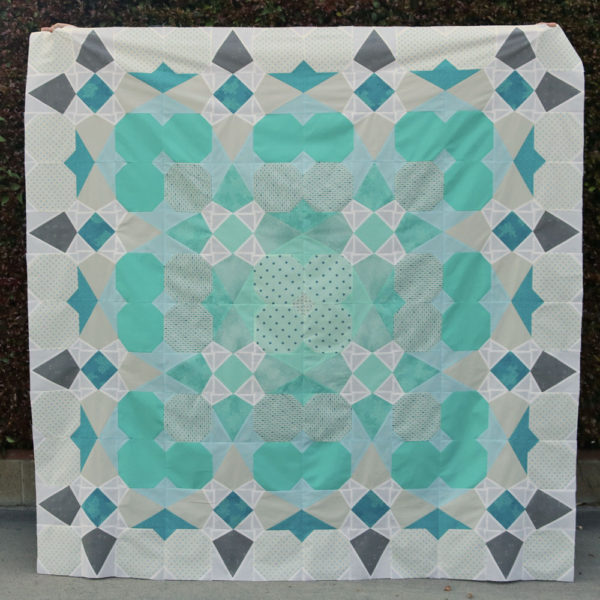 This image has an empty alt attribute; its file name is Envy-quilt-square-600x600.jpg