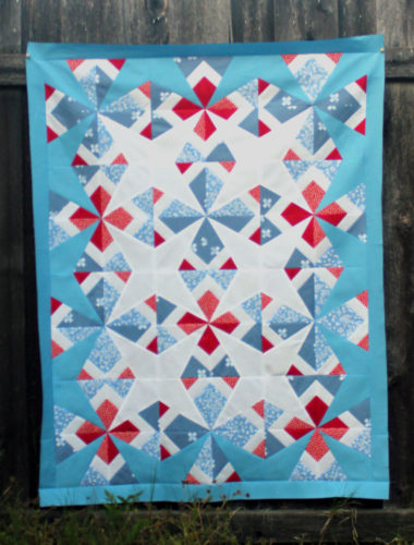 "Sparkler Quilt" is a Free Patriotic Quilt Pattern designed by Carolina Moore from Always Expect Moore!